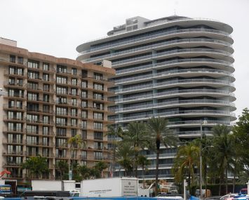 Eighty Seven Park (right) and Champlain Towers South (left), a week after the collapse.