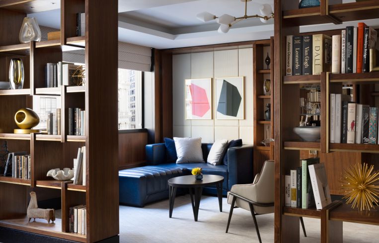 MIDTOWN LUXURY: The Langham hotel on Fifth Avenue converted administrative space into a 2,500-square-foot lounge and bar with food service that guests can pay an additional fee to access. The midcentury modern-inspired space also has a kitchen with a marble-topped bar where guests can find a hot and cold buffet every morning, as well as an omelet station with a chef.