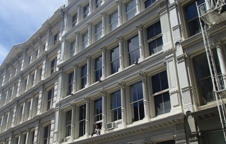 The large white building at 121 Greene Street.