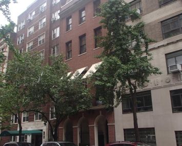 The small brown townhouse at 15 East 88th Street.