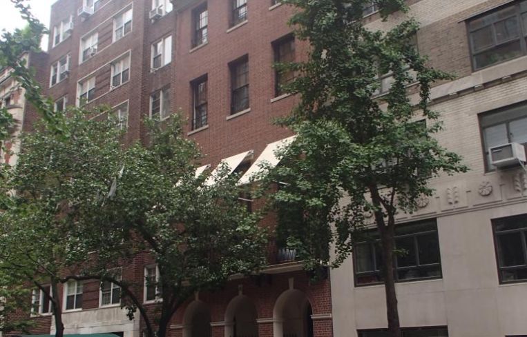 The small brown townhouse at 15 East 88th Street.