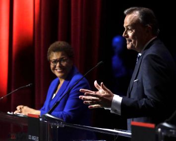 U.S. Rep. Karen Bass and developer Rick Caruso during the mayoral debate at Bovard Auditorium on the USC campus in March 2022.