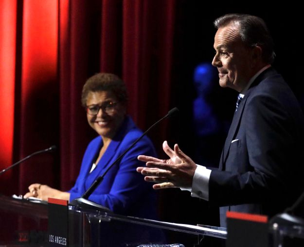 U.S. Rep. Karen Bass and developer Rick Caruso during the mayoral debate at Bovard Auditorium on the USC campus in March 2022.