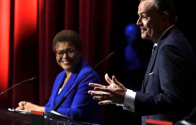 U.S. Rep. Karen Bass and developer Rick Caruso during the mayoral debate at Bovard Auditorium on the USC campus in March 2022.