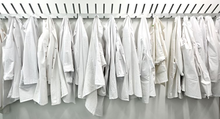 Lab coats hang in a new biotech center. About 4.5 percent of all biological and biomedical sciences PhDs in the nation’s largest markets are issued from L.A.-Orange County thanks to institutions like UCLA, UC-Irvine and the University of Southern California.
