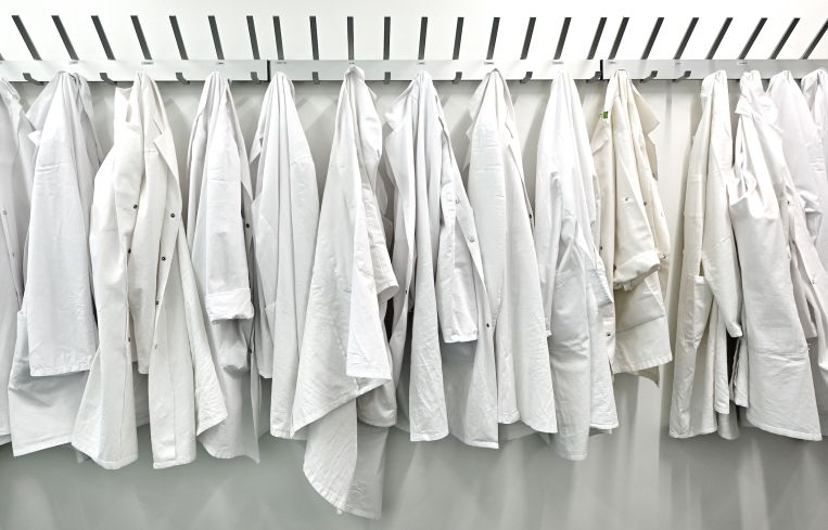 Lab coats hang in a new biotech center. About 4.5 percent of all biological and biomedical sciences PhDs in the nation’s largest markets are issued from L.A.-Orange County thanks to institutions like UCLA, UC-Irvine and the University of Southern California.