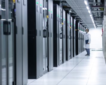 An engineer inspects the computer servers at a data center.