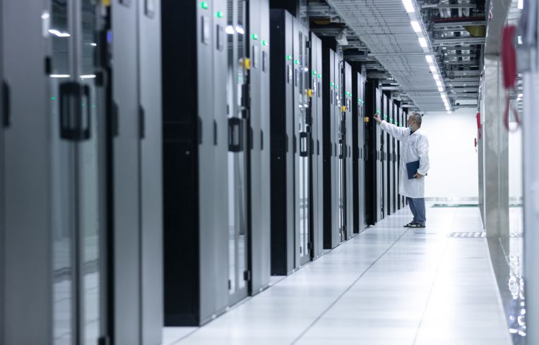 An engineer inspects the computer servers at a data center.