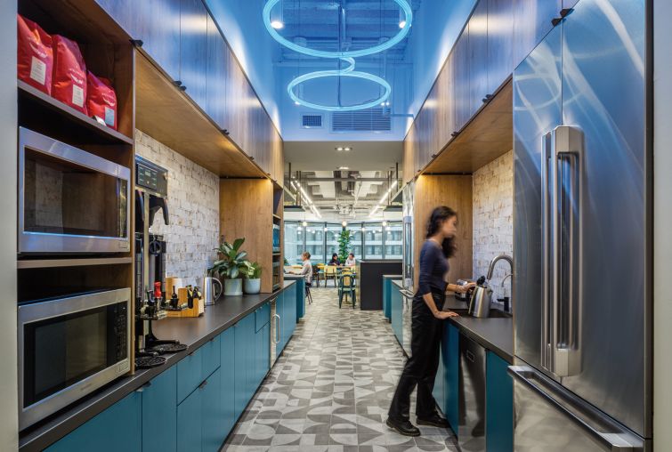 Biotech company Schrödinger created a new 100,000-square-foot office space at 1540 Broadway, complete with science-oriented motifs like the Schrödinger equation in contrasting tile in a cafe, lines of code and equations on the walls and meeting rooms with names like "The Nucleus."