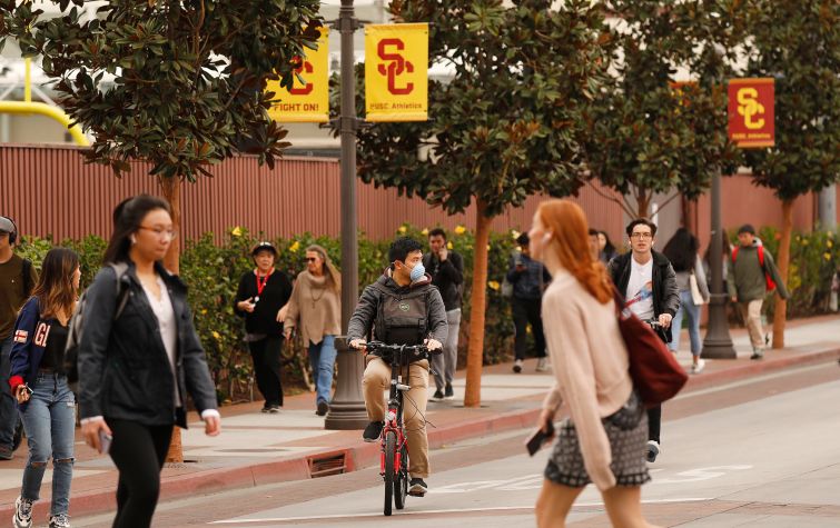 Students make their way between classes on the University of Southern California Los Angeles campus.