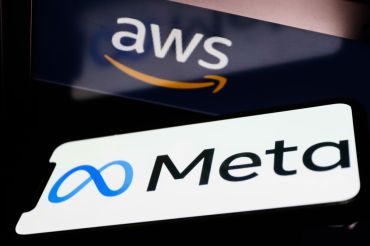 Meta logo displayed on a phone screen and and Amazon Web Services logo displayed on a laptop screen are seen in this illustration photo taken in Krakow, Poland on December 1, 2021. (Photo by Jakub Porzycki/NurPhoto via Getty Images)