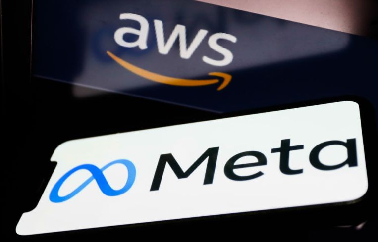 Meta logo displayed on a phone screen and and Amazon Web Services logo displayed on a laptop screen are seen in this illustration photo taken in Krakow, Poland on December 1, 2021. (Photo by Jakub Porzycki/NurPhoto via Getty Images)