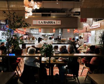 People eat at a restaurant in Hudson Yards' Spanish Market, Mercado Little Spain, on May 12, 2022 in New York City.
