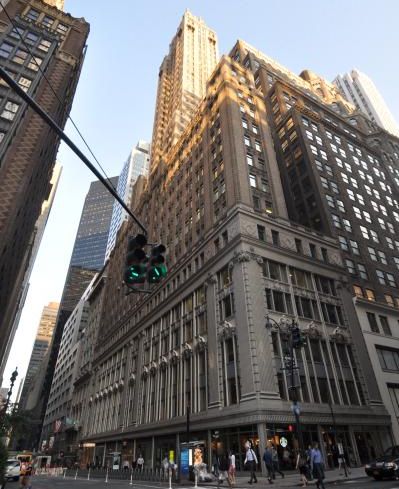 The tall, L-shaped building at 295 Madison Avenue.