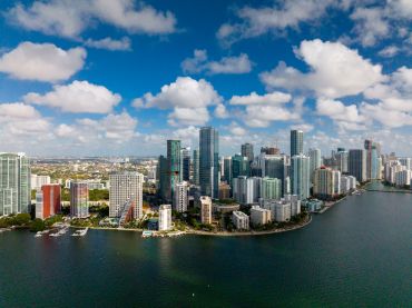 View of Miami Florida skyline with clouds on Atlantic Ocean. 