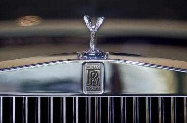 The polished grill of a Rolls Royce. 