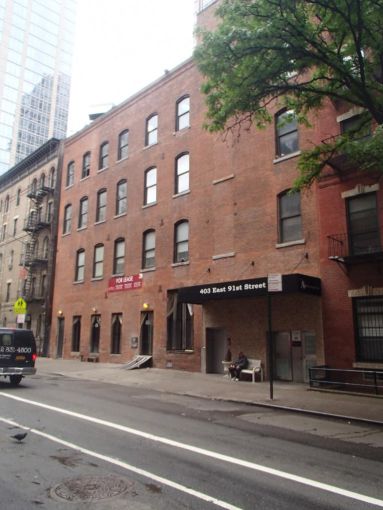 The red brick four-story building at 403 East 91st Street.