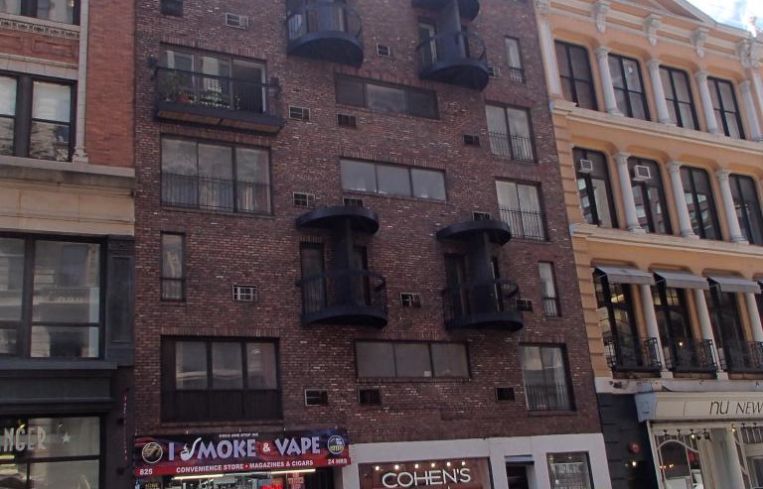 The short, brick condo building at 825 Broadway.