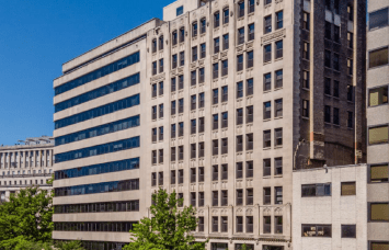 Buildings like 1010 Vermont Avenue NW are being converted from office to multifamily. 
