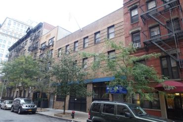 The short brick building at 147 East 26th Street.