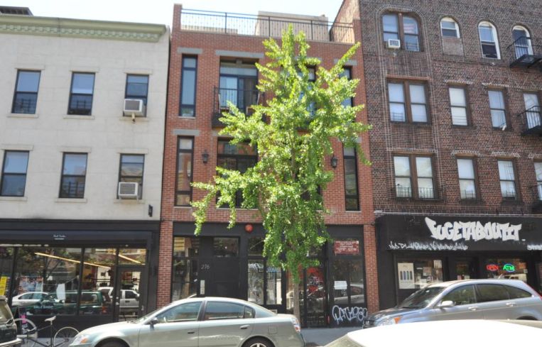 The short, three story building at 276 Grand Street.