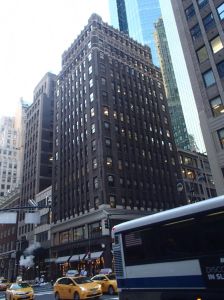 The brown office tower at 424 Madison Avenue.