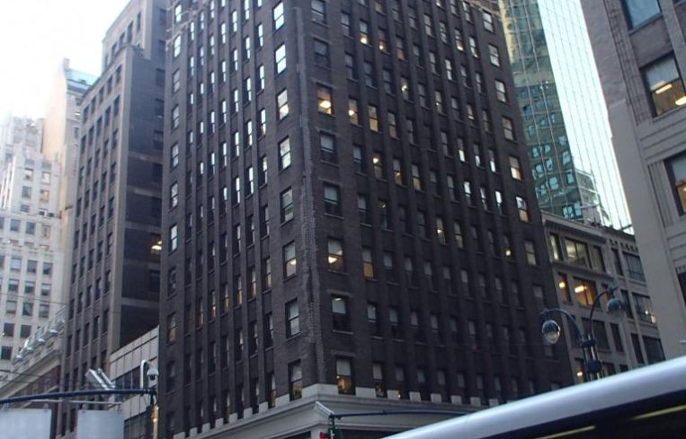 The brown office tower at 424 Madison Avenue.
