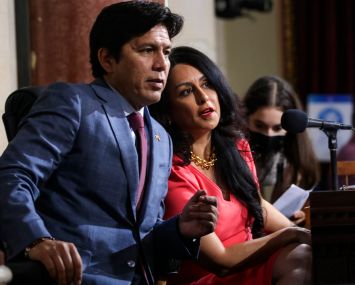 Los Angeles City Councilman Kevin de León, left, and City Council President Nury Martinez confer on Tuesday.