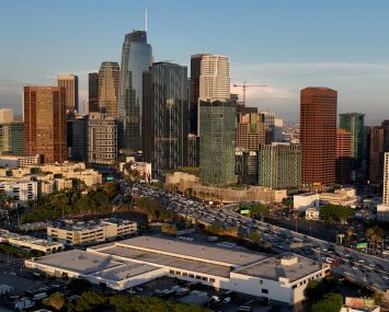 An aerial view of of the downtown Los Angeles skyline as seen from the Pico-Union area of Los Angeles at dusk.