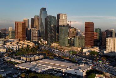 An aerial view of of the downtown Los Angeles skyline as seen from the Pico-Union area of Los Angeles at dusk.