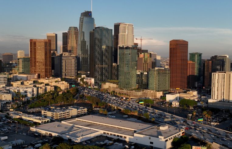 An aerial view of of the downtown Los Angeles skyline as seen from the Pico-Union area of Los Angeles at dusk.