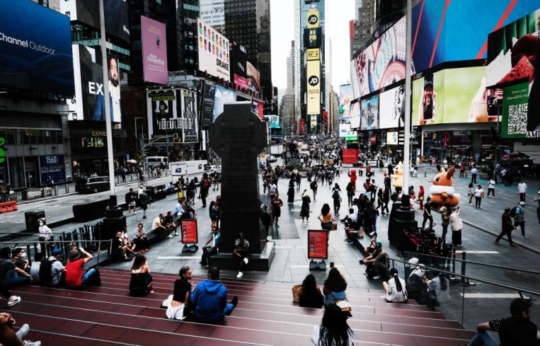 People spend an evening in Times Square on Sept. 14, 2021 in New York City.