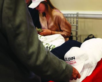 A supporter takes a campaign hat on June 28, 2022 in Baldwin, New York.