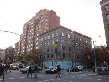 The shorter brick building and ground floor retail space at 300 West 22nd Street.