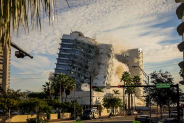 The decaying hotel, Miami Beach’s historic Deauville Beach Resort, which once hosted everyone from the Beatles to President John F. Kennedy, was imploded Sunday morning, November 13, 2022, after it was declared an unsafe structure. Hundreds of people came out to see the building come crashing to the ground.