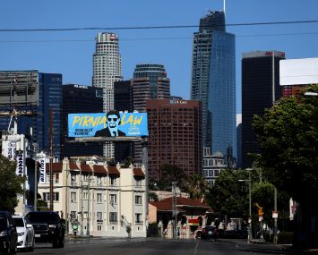 The downtown skyline seen from the Pico-Union neighborhood along Olympic Boulevard. The USC forecast predicts monthly rents will increase by at least $100 in all five SoCal markets over the next two years, with vacancy rates also due to remain at low levels.
