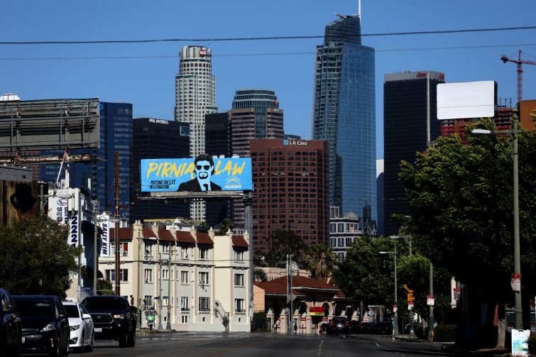The downtown skyline seen from the Pico-Union neighborhood along Olympic Boulevard. The USC forecast predicts monthly rents will increase by at least $100 in all five SoCal markets over the next two years, with vacancy rates also due to remain at low levels.