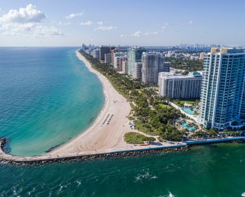 Florida, Miami, Bal Harbour, Haulover Inlet with luxury condos and Ritz Carlton Hotel, Aerial.