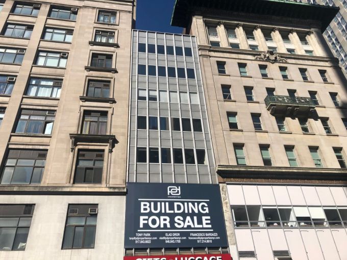 Building for Sale sign on Fifth Avenue, Manhattan, New York