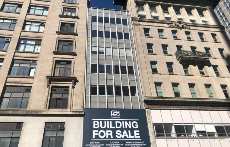 Building for Sale sign on Fifth Avenue, Manhattan, New York
