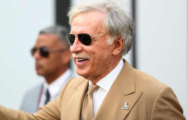 Owner Stan Kroenke of the Los Angeles Rams smiles and waves to fans in the tunnel prior to an NFL football game in November.