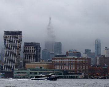 Storm clouds pass by the Empire State Building in New York City on December 23.