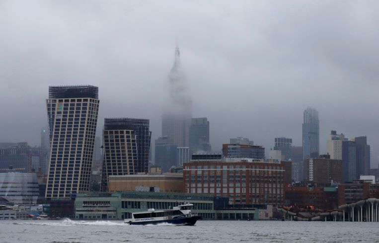 Storm clouds pass by the Empire State Building in New York City on December 23.