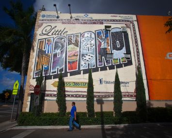 A mural is painted on a wall at 27th Avenue and SW 8th St (Calle Ocho).