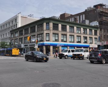 The three-story apartment building at 2100 Adam Clayton Powell Jr. Boulevard.