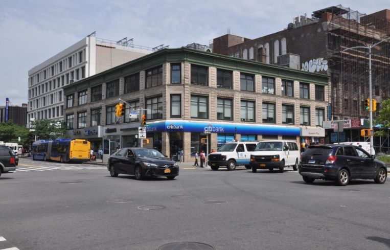 The three-story apartment building at 2100 Adam Clayton Powell Jr. Boulevard.