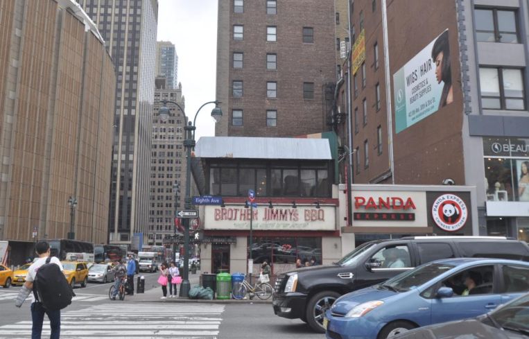 The two-story building 416 Eighth Avenue.