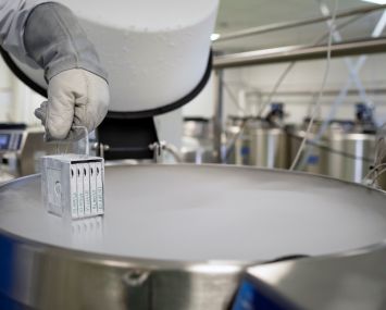 A biologist shows stem cell samples, stored in large liquid nitrogen freezers, submerged in liquid nitrogen vapor at minus 175 degrees Celsius.