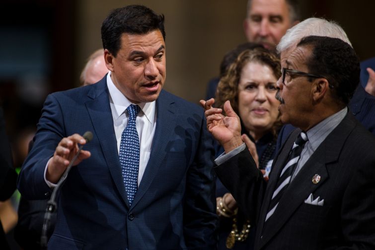 Former Los Angeles City Councilman Jose Huizar, left, agreed to plead guilty to racketeering and tax evasion.