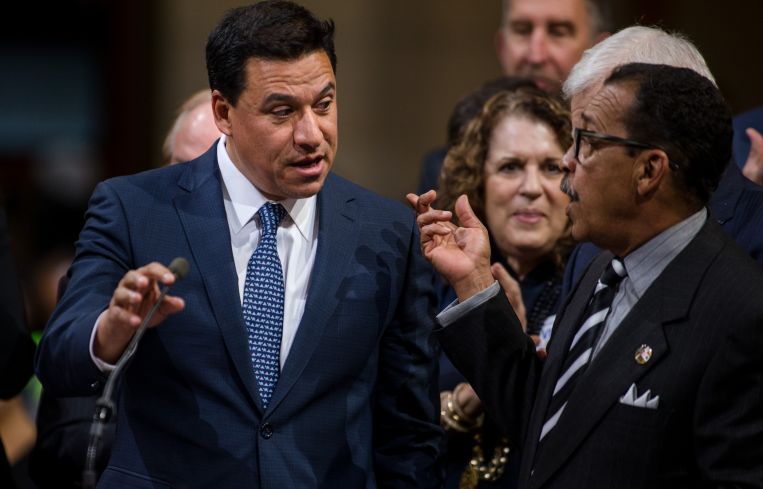 Former Los Angeles City Councilman Jose Huizar, left, agreed to plead guilty to racketeering and tax evasion.